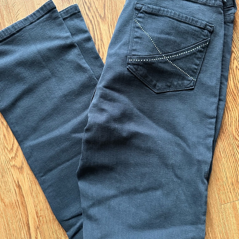 NYDJ black straight leg jeans with rhinestone accent back pockets.